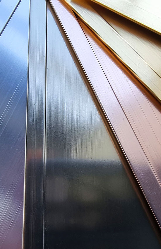 Powder-coated metal panels displaying a range of colours, gloss levels, and finish options available through Cloverdale Paint.