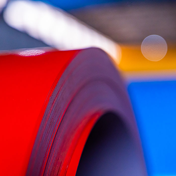 Powder-coated metal coil demonstrating consistent colour performance across manufacturing applications.