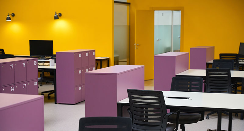Modern office environment showcasing powder-coated furniture, storage units, and partitions designed for durable and attractive commercial interior spaces.