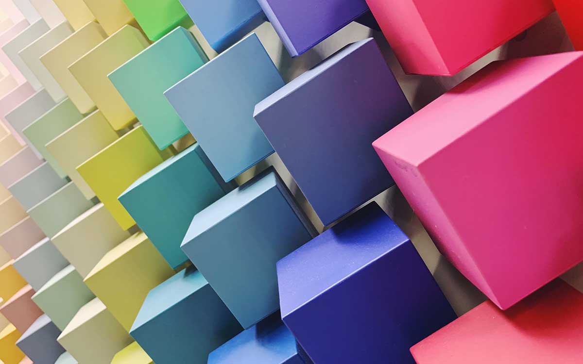 Abstract display of colourful powder coated panels showcasing a wide range of custom colours, textures, and finish options available with powder coating paint.