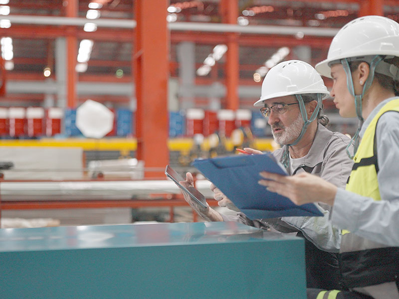 Industrial facility featuring powder-coated structures and equipment finished to standardized colour specifications.