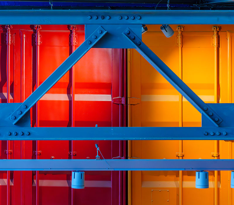 Powder-coated architectural structure combining vibrant colour, durability, and long-term finish performance.