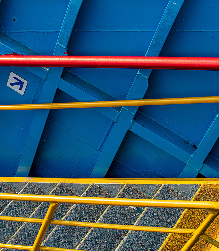 Powder-coated industrial structures, safety railings, and equipment used across manufacturing and commercial applications.