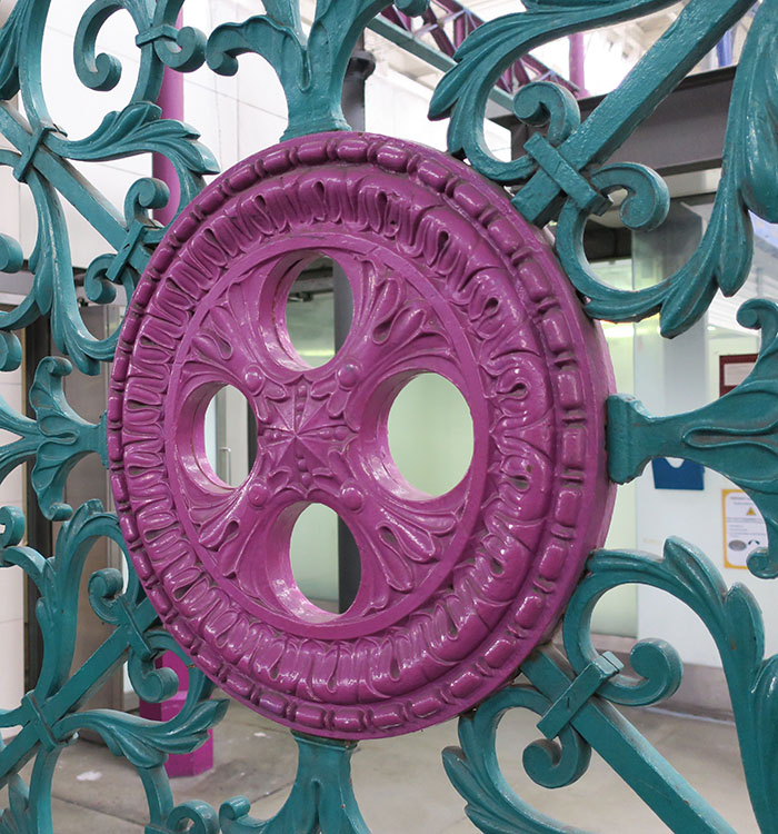 Decorative architectural metalwork finished with custom powder coating colours from Cloverdale Paint.